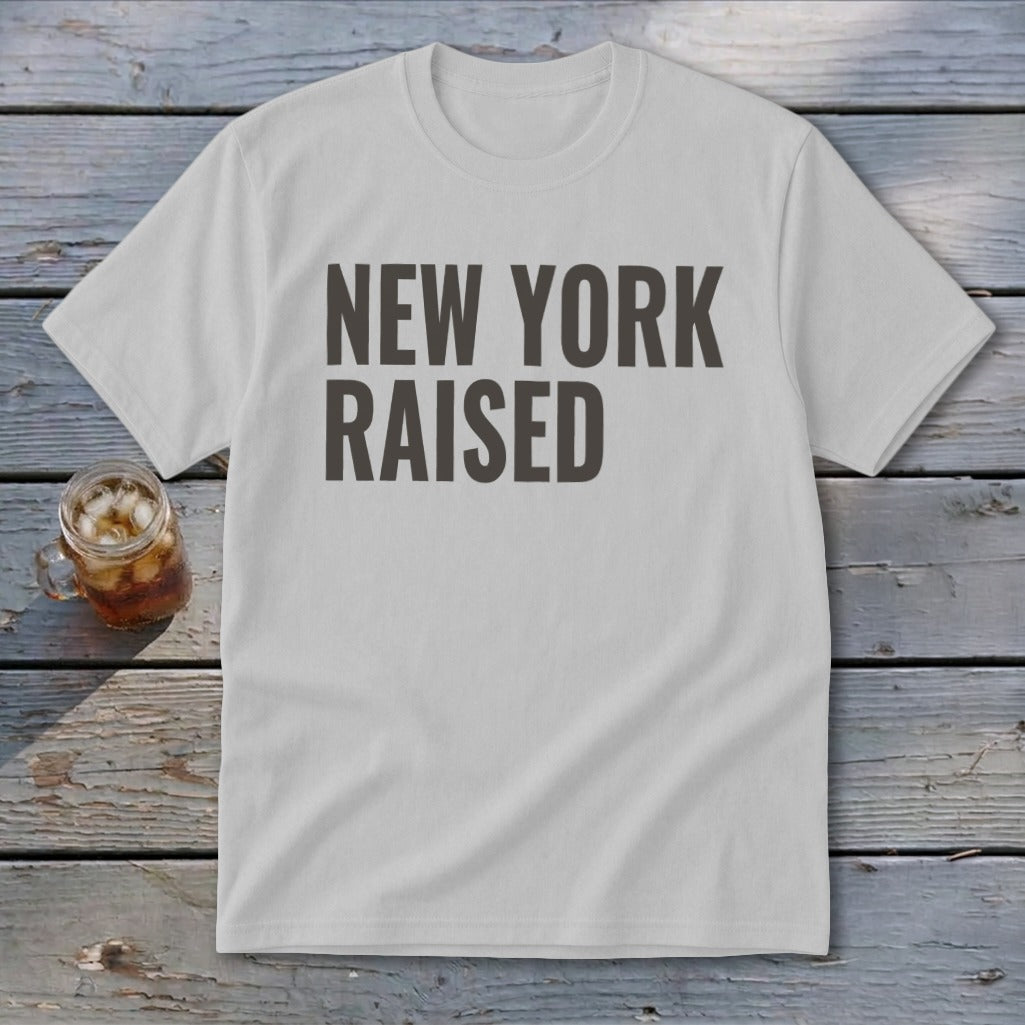 Light grey t-shirt with dark grey text reading "NEW YORK RAISED".