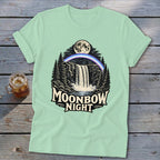 T-shirt graphic of a moonbow over a waterfall with "Moonbow Night" text.
