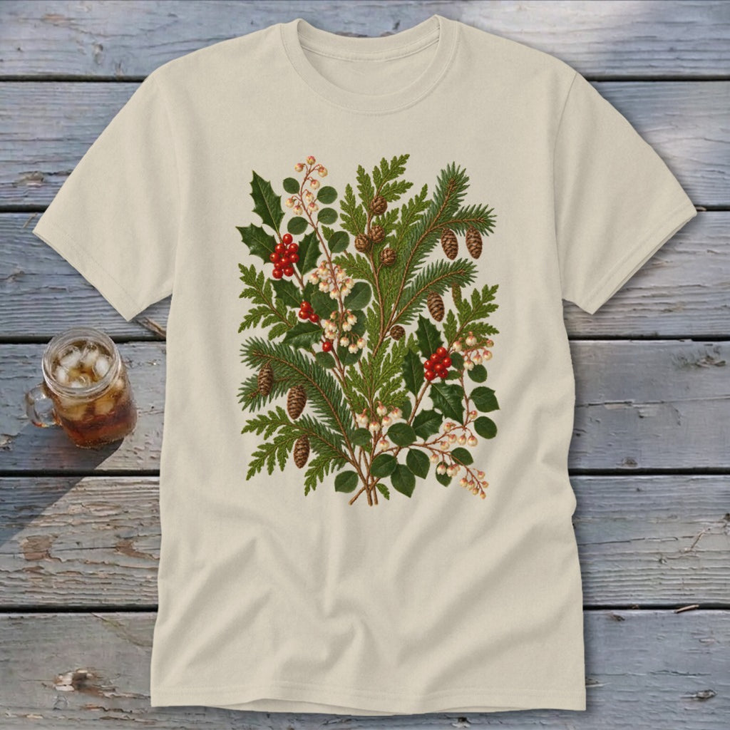 Cream t-shirt with a botanical illustration of pine, holly, pinecones, and berries.