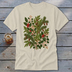 Cream t-shirt with a botanical illustration of pine, holly, pinecones, and berries.