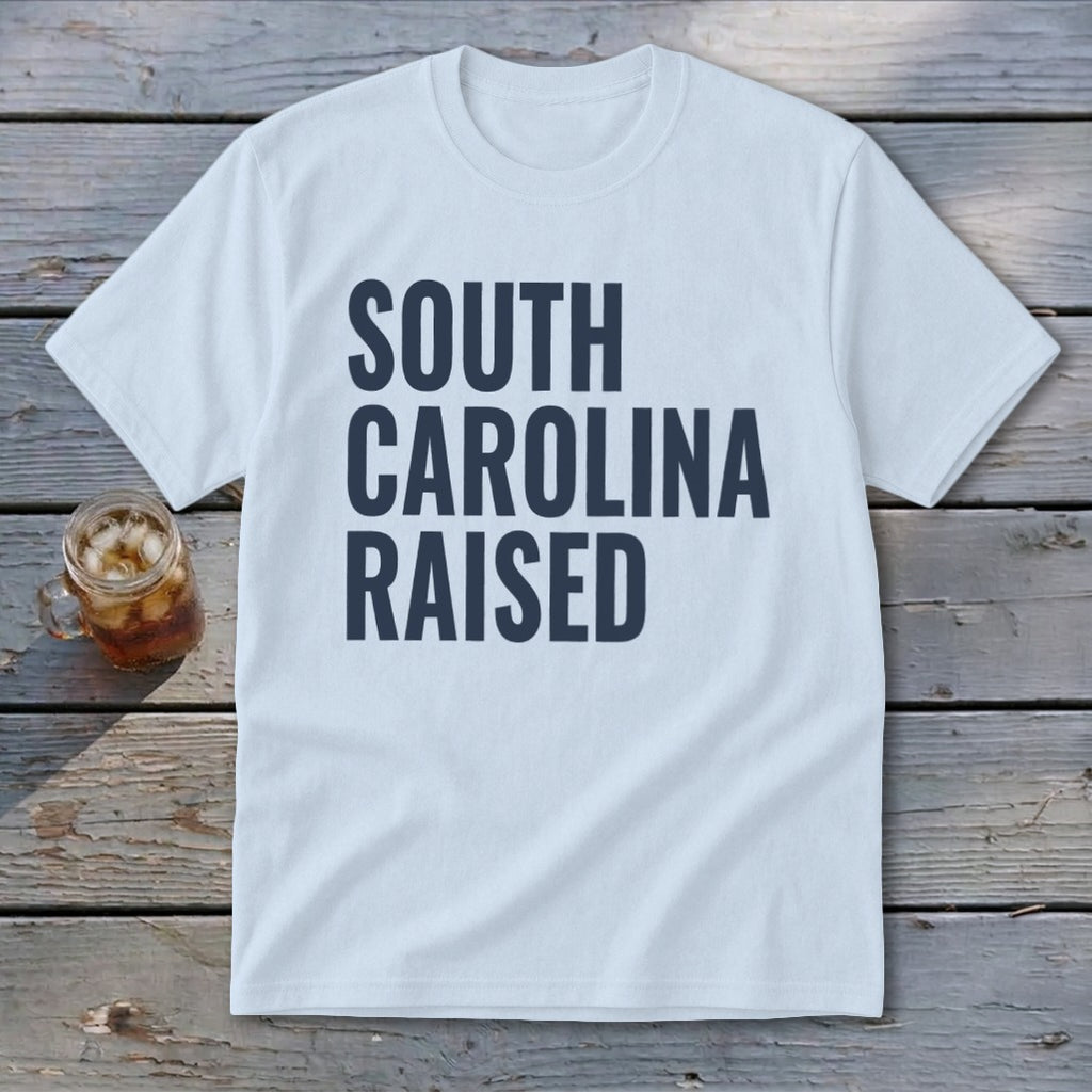 Light blue t-shirt with "SOUTH CAROLINA RAISED" in dark blue lettering.