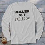 White long-sleeve t-shirt with "HOLLER NOT HOLLOW" text.