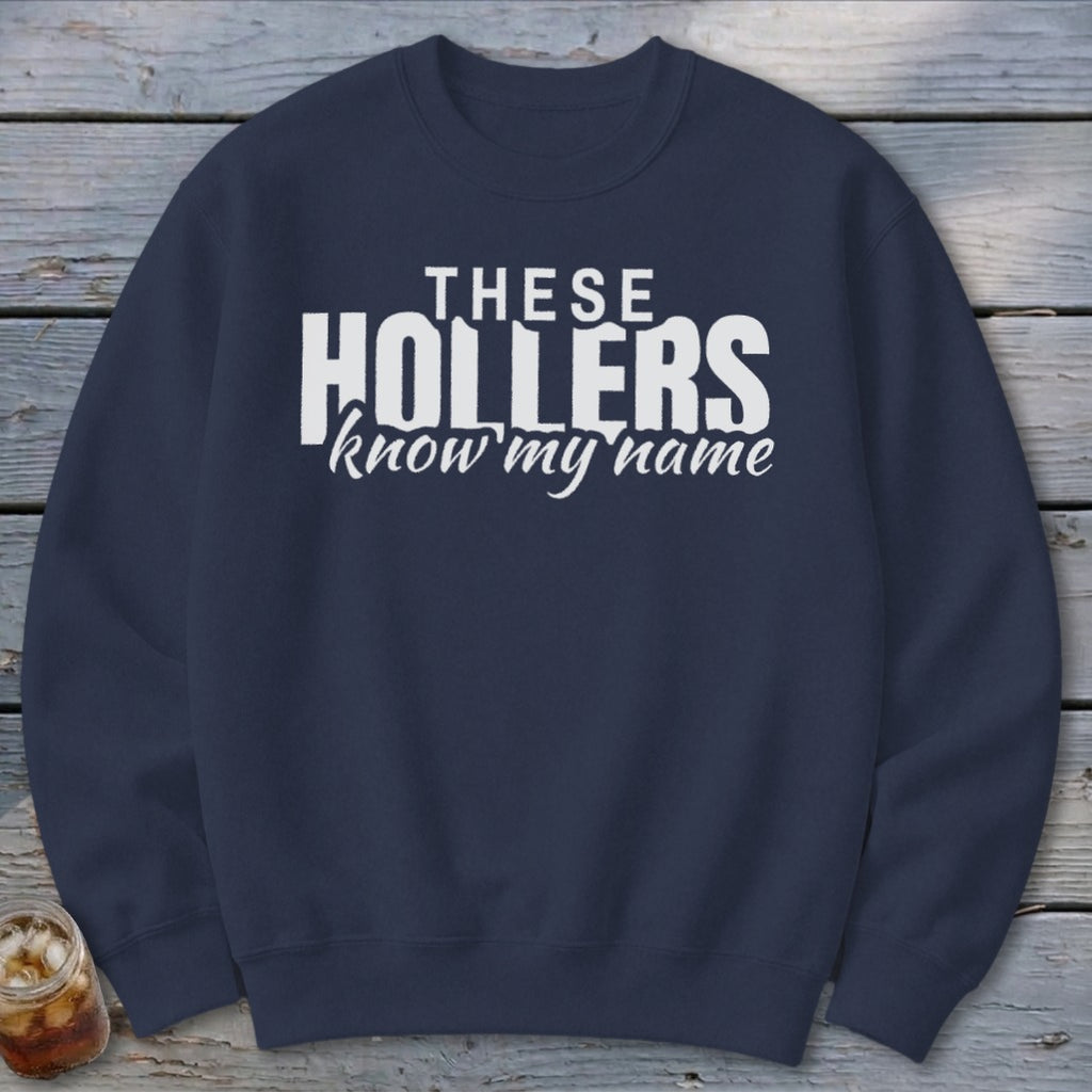 Navy sweatshirt with white text that reads "THESE HOLLERS know my name".
