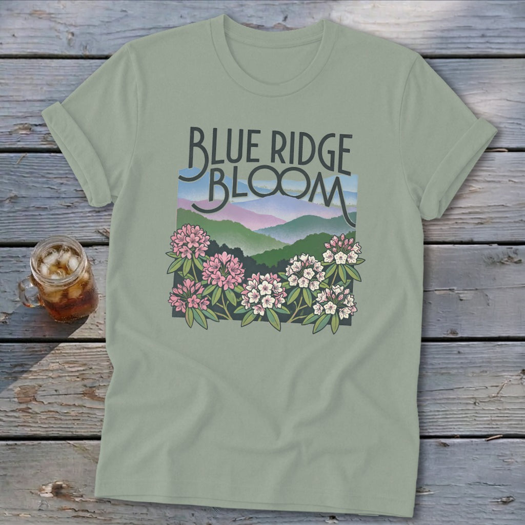Light green t-shirt with "Blue Ridge Bloom" text and mountain floral graphic.