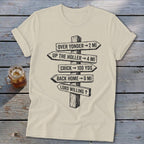 Cream t-shirt featuring a black graphic of a wooden directional sign with humorous distance text.