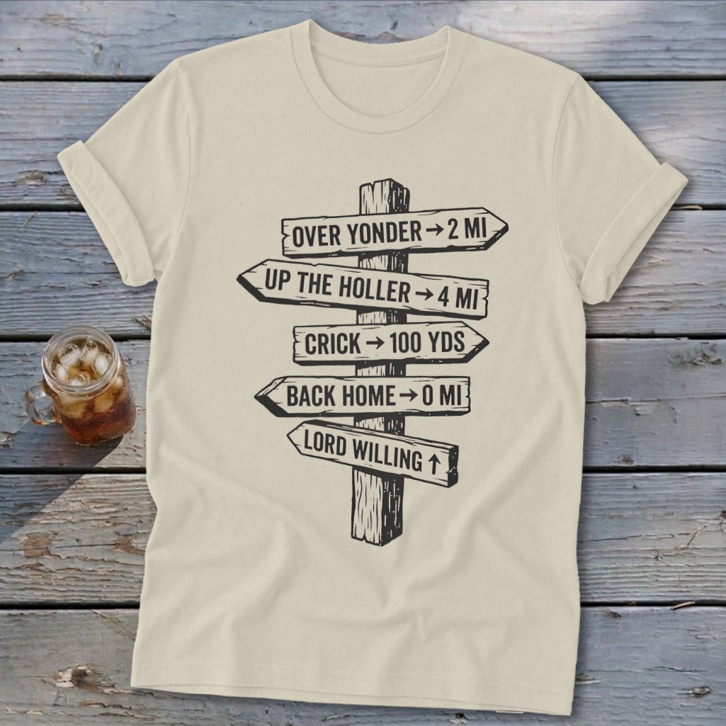 Cream t-shirt featuring a black graphic of a wooden directional sign with humorous distance text.