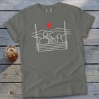 Gray t-shirt with line art of couple and dog on a swing, red heart above.