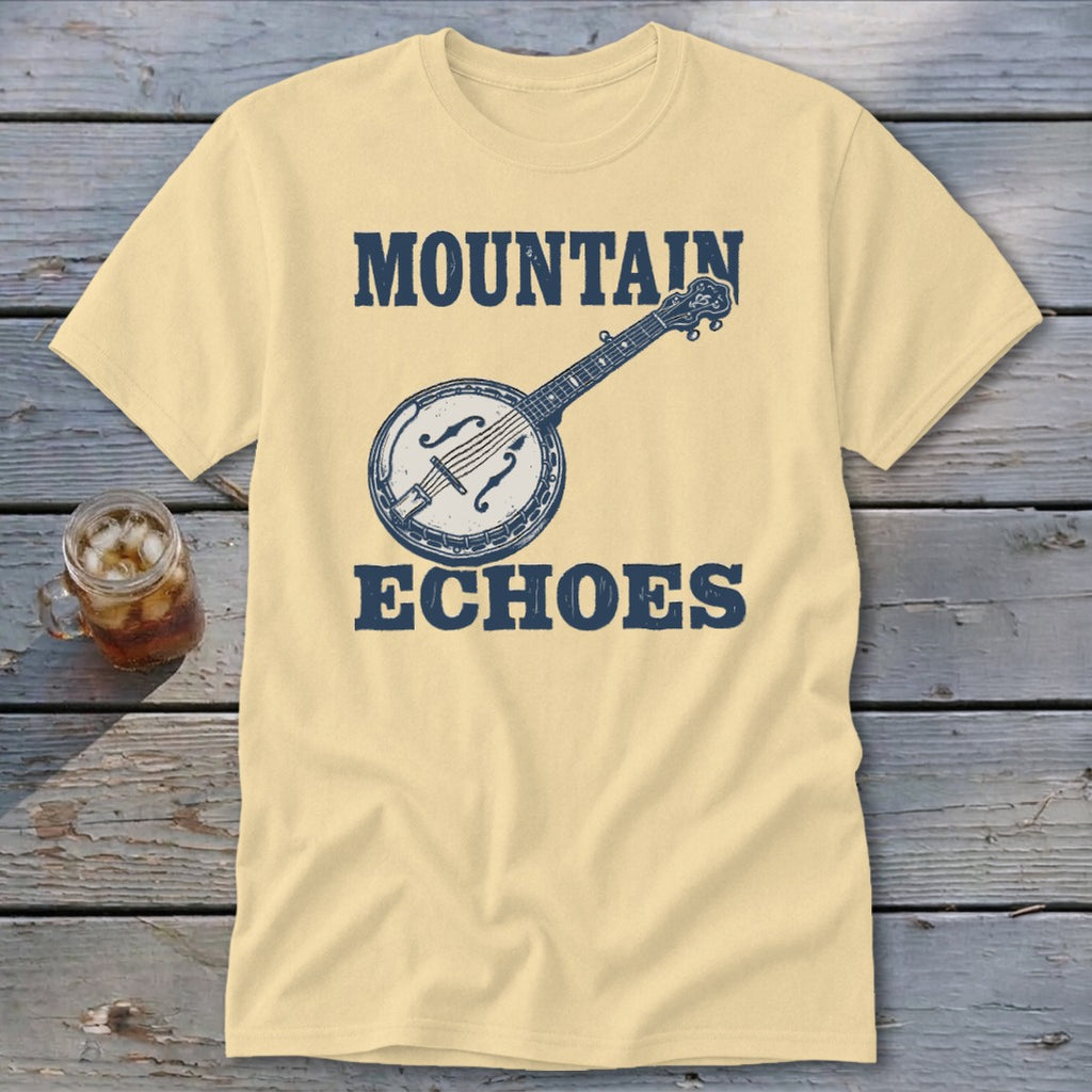 Cream-colored t-shirt with blue text reading MOUNTAIN ECHOES and an illustration of a banjo.