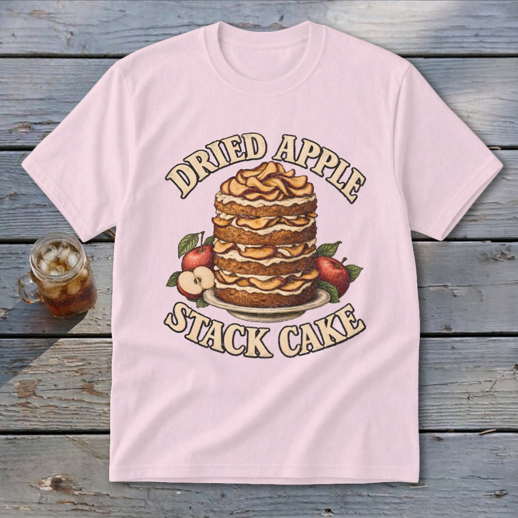 Pink t-shirt with "Dried Apple Stack Cake" graphic featuring a layered cake and apples.