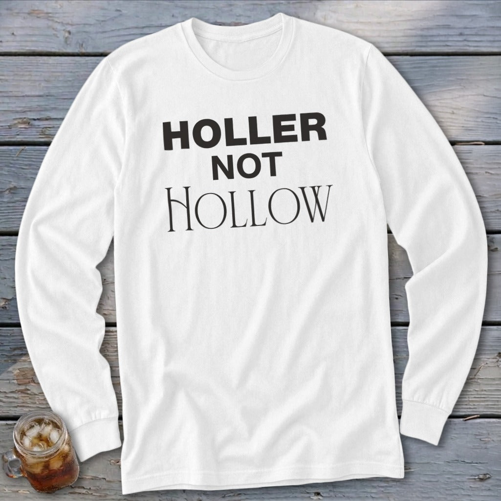White long-sleeved shirt with black text reading "HOLLER NOT HOLLOW".