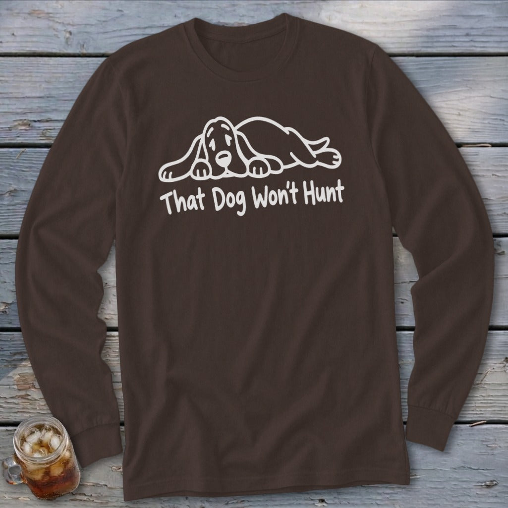 Brown long-sleeve shirt featuring white line art of a resting hound dog and the text That Dog Won't Hunt.