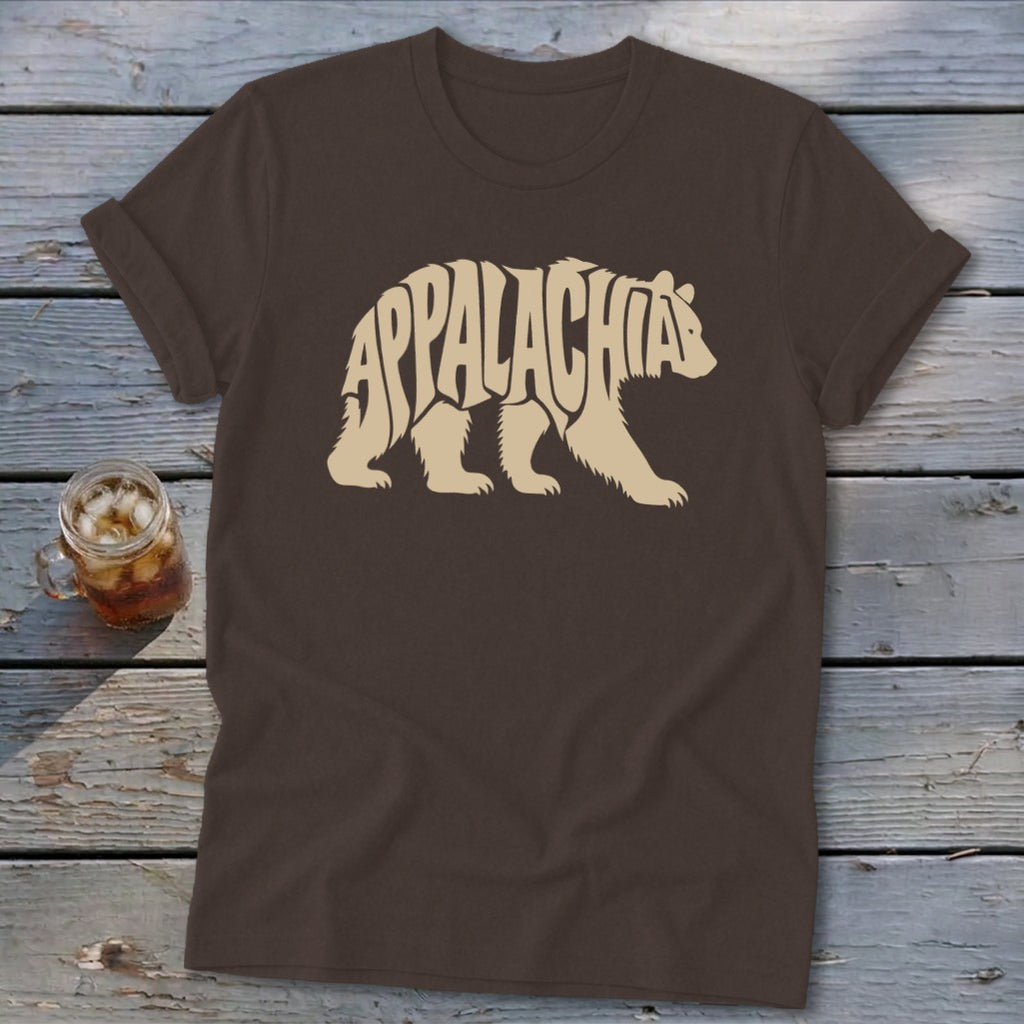 A brown short-sleeve t-shirt features a cream graphic of a walking bear filled with the word Appalachia.