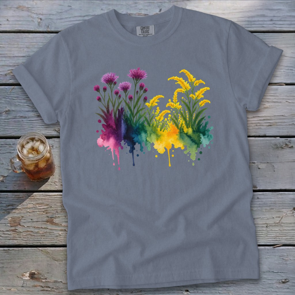 Gray t-shirt with watercolor floral design of pink and yellow flowers with colorful splashes.