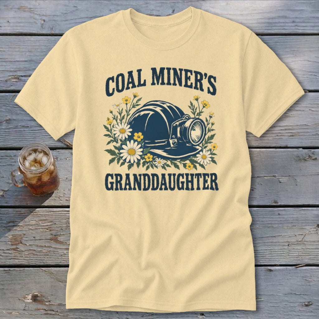 Pale yellow t-shirt with "Coal Miner's Granddaughter" text and a mining helmet graphic.