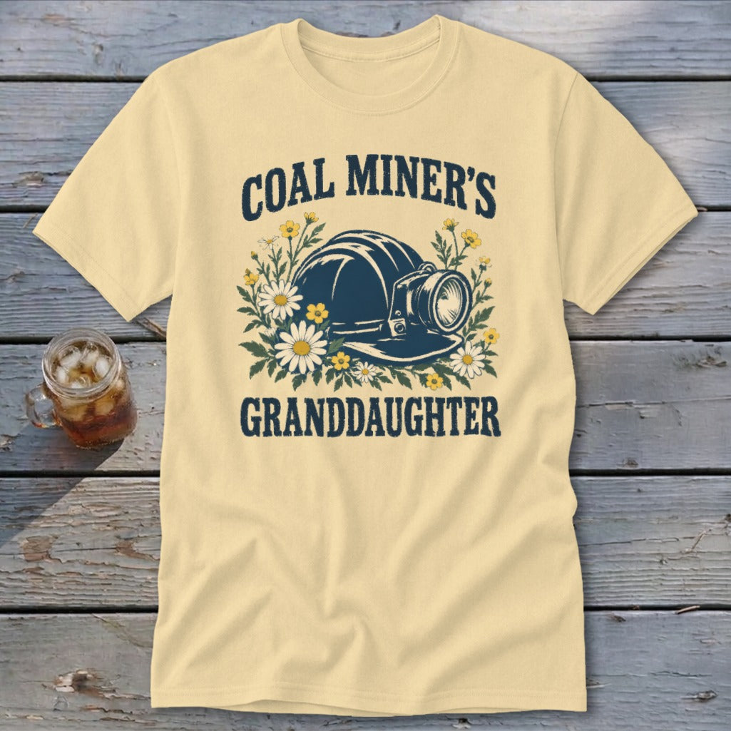 Pale yellow t-shirt with "Coal Miner's Granddaughter" text and a mining helmet graphic.