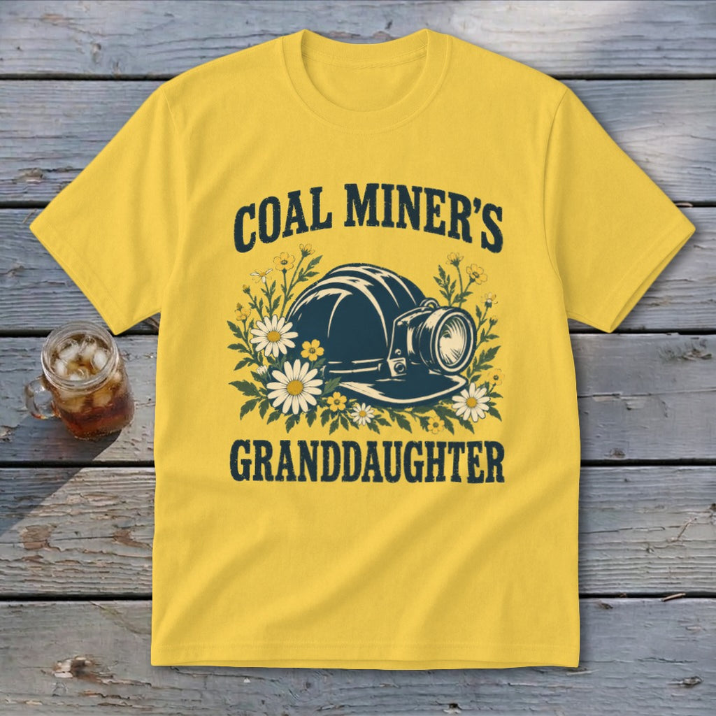 Yellow t-shirt with "Coal Miner's Granddaughter" text and coal miner helmet graphic.