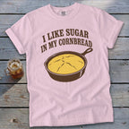 Pink t-shirt with "I Like Sugar In My Cornbread" and a cast-iron skillet of cornbread graphic.