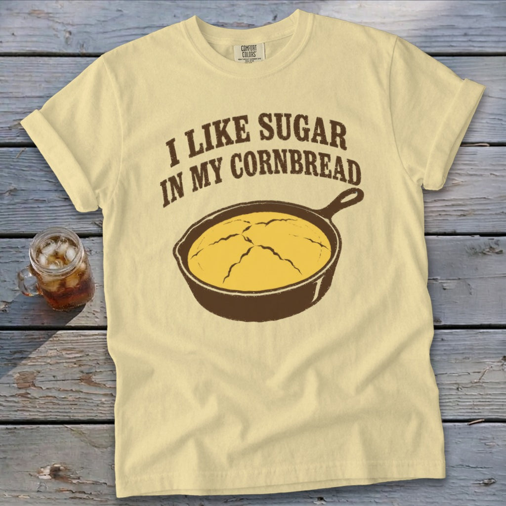 Yellow t-shirt with "I like sugar in my cornbread" and cast iron skillet graphic.