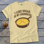 Yellow t-shirt with "I like sugar in my cornbread" and cast iron skillet graphic.