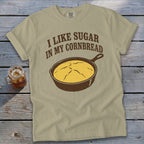 Tan t-shirt with "I like sugar in my cornbread" and a cast iron skillet graphic.