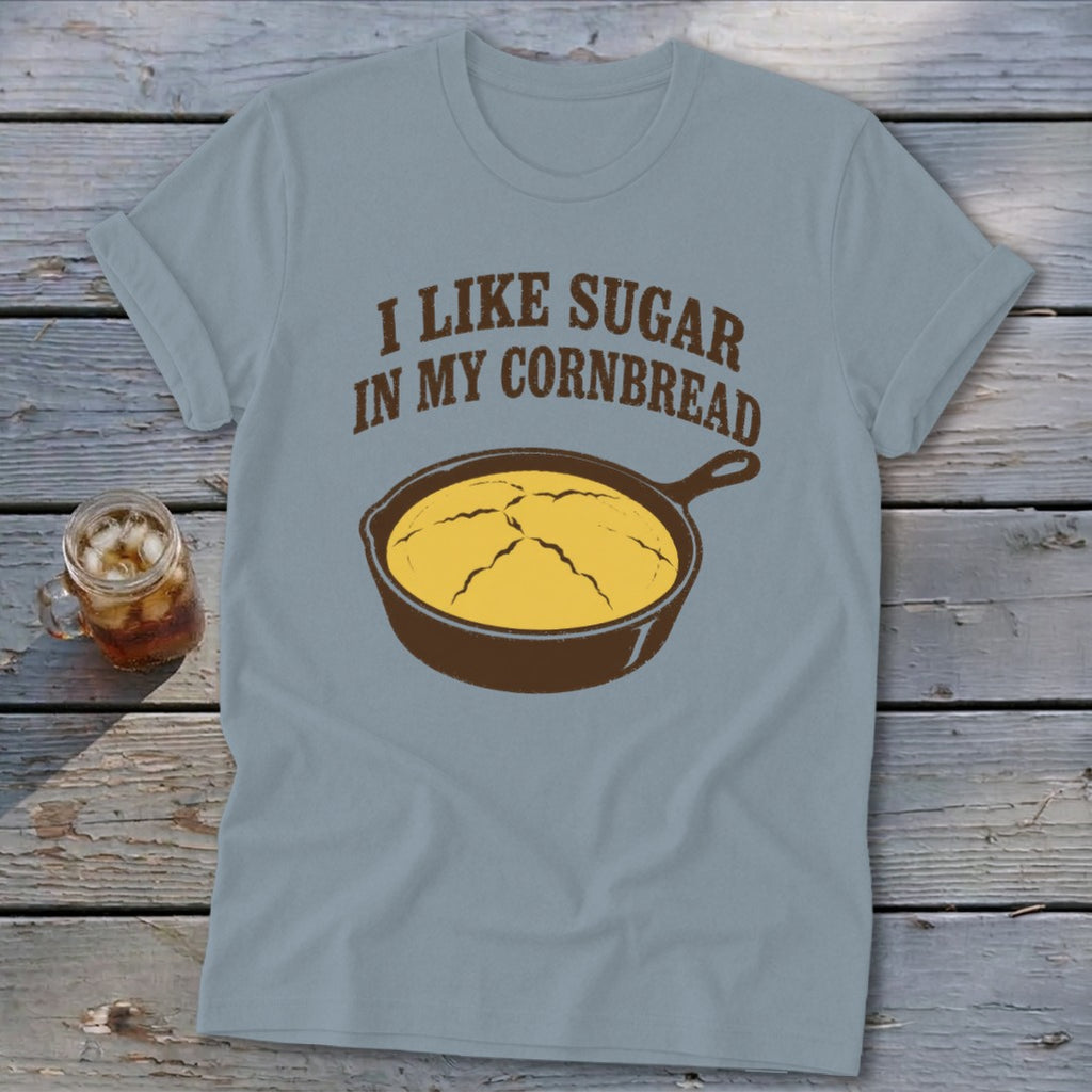 Light blue t-shirt with text "I LIKE SUGAR IN MY CORNBREAD" and cast iron skillet.