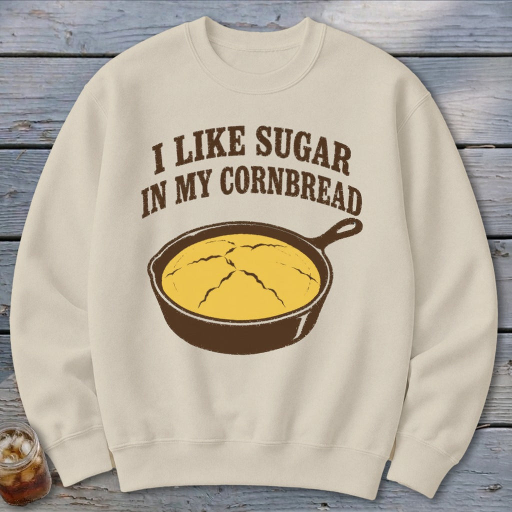 Cream sweatshirt with "I like sugar in my cornbread" text and skillet of cornbread graphic.