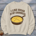 Cream sweatshirt with "I like sugar in my cornbread" text and skillet of cornbread graphic.