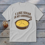 Light gray t-shirt with brown text "I LIKE SUGAR IN MY CORNBREAD" and skillet graphic.