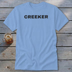 Light blue t-shirt with "CREEKER" in black distressed text.