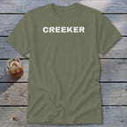 Olive green t-shirt with "CREEKER" printed in white on the chest.