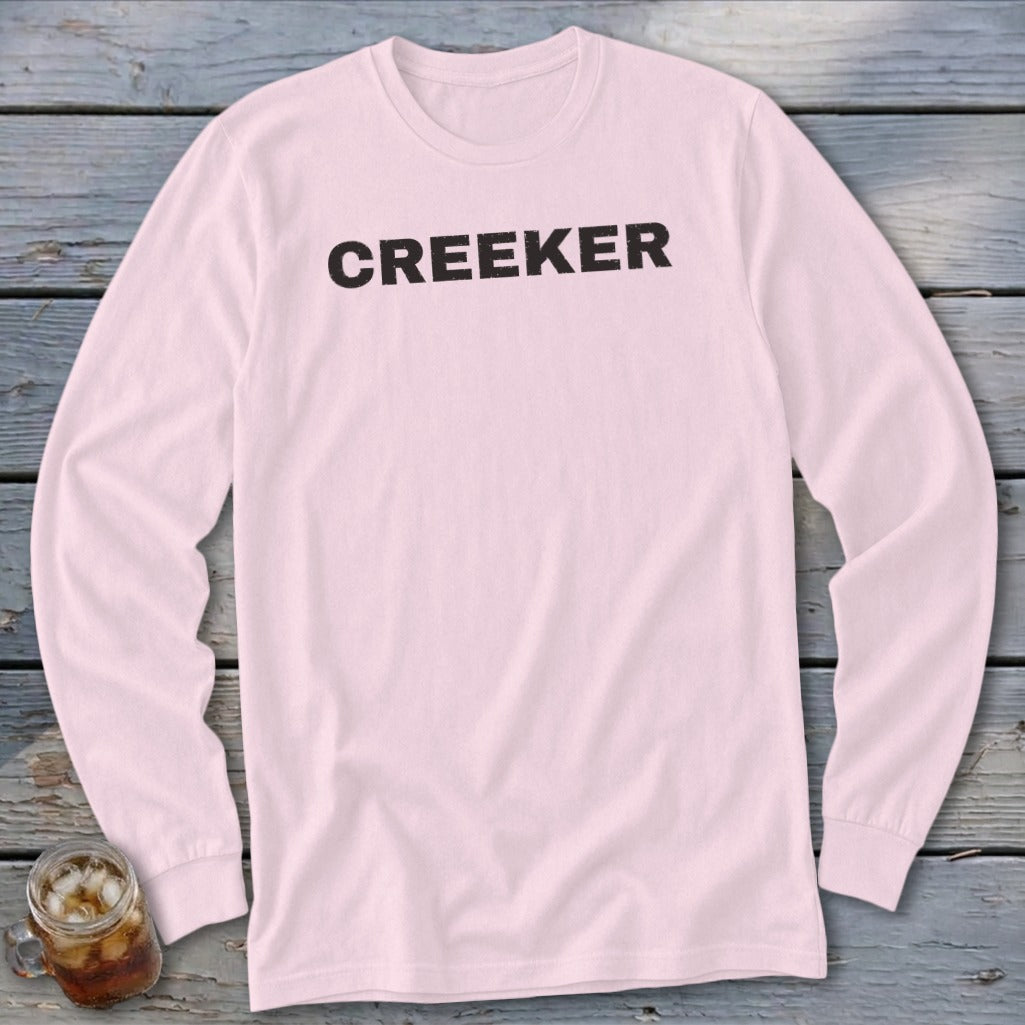 Pink long sleeve t-shirt with black "CREEKER" text.