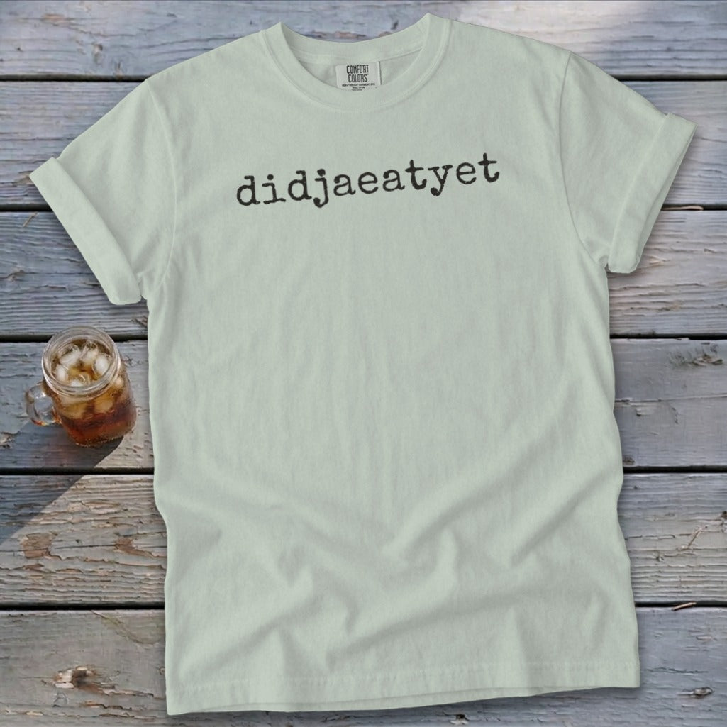Light mint green t-shirt with black text "didjaeatyet" and a glass of iced tea.