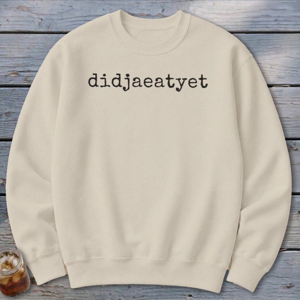 Cream sweatshirt with "didjaeatyet" printed in black text.