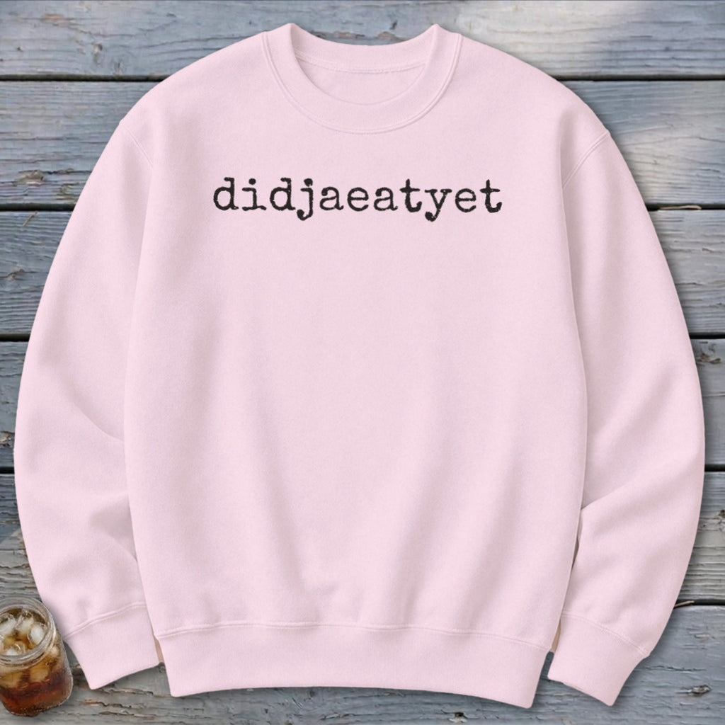 Light pink crewneck sweatshirt with black text that reads "didjaeatyet".