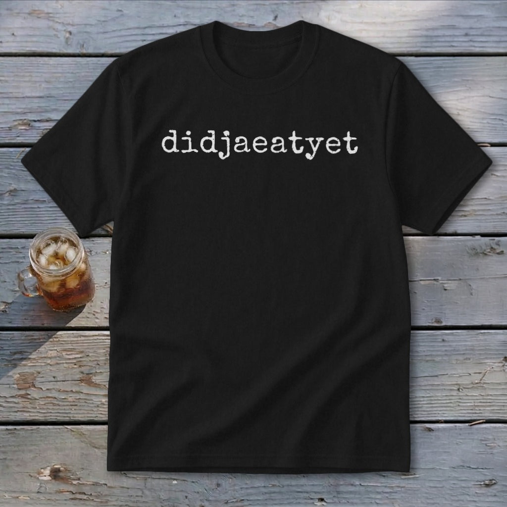 Black t-shirt with "didjaeatyet" text in white, next to a glass of iced tea.