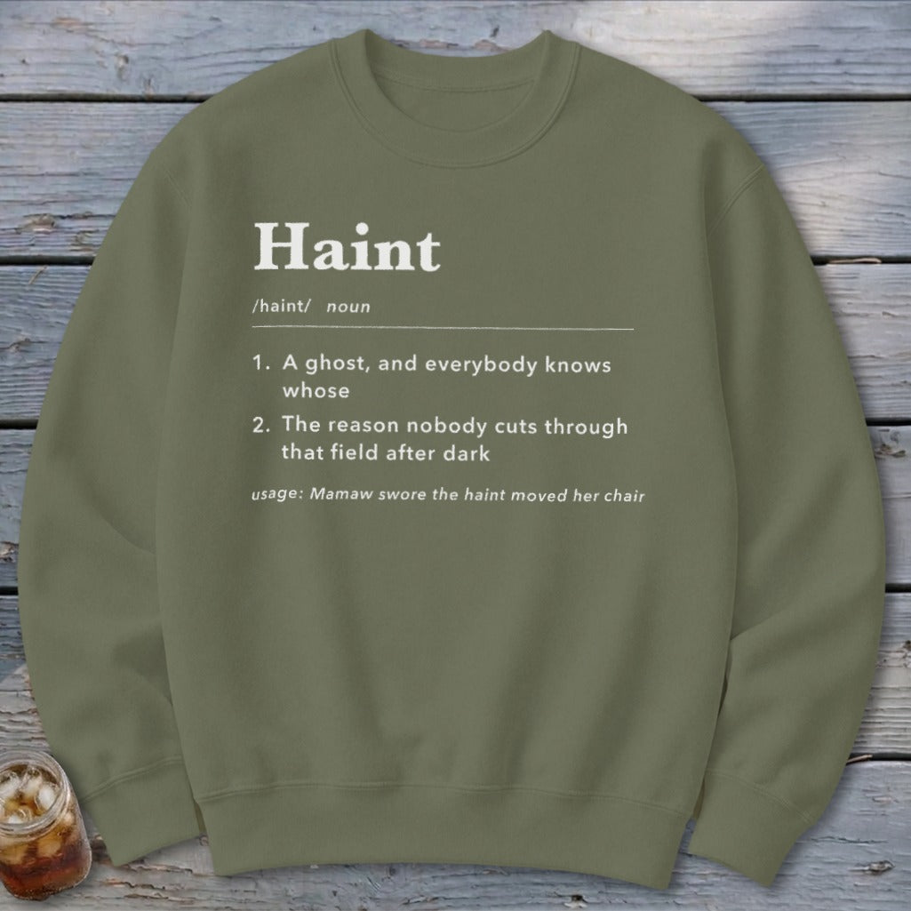 Olive green sweatshirt with the definition of "Haint" printed in white text.