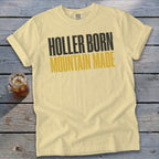 Light yellow t-shirt with "HOLLER BORN MOUNTAIN MADE" text.