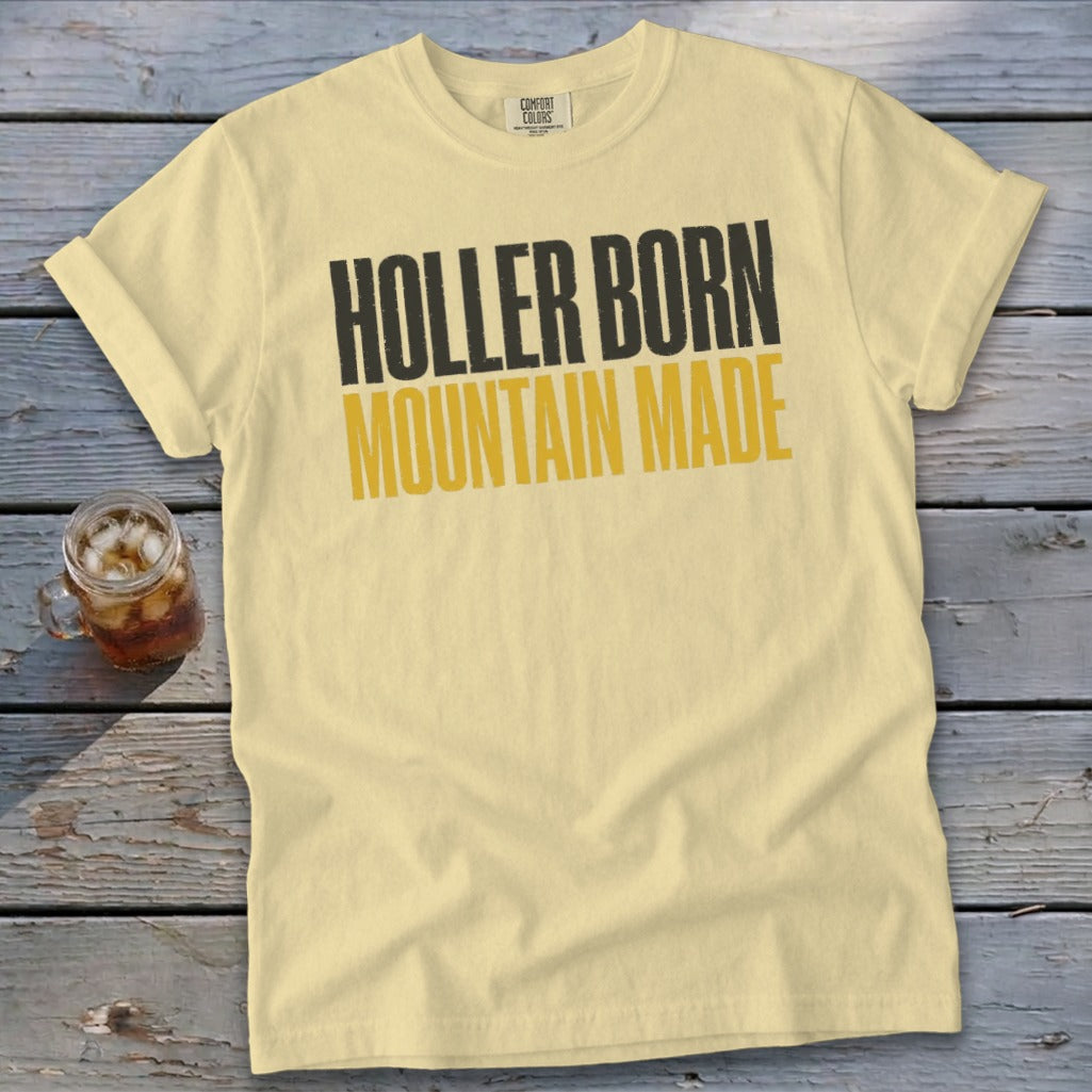 Light yellow t-shirt with "HOLLER BORN MOUNTAIN MADE" text.