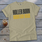 Tan t-shirt with black and yellow "Holler Born Mountain Made" text.