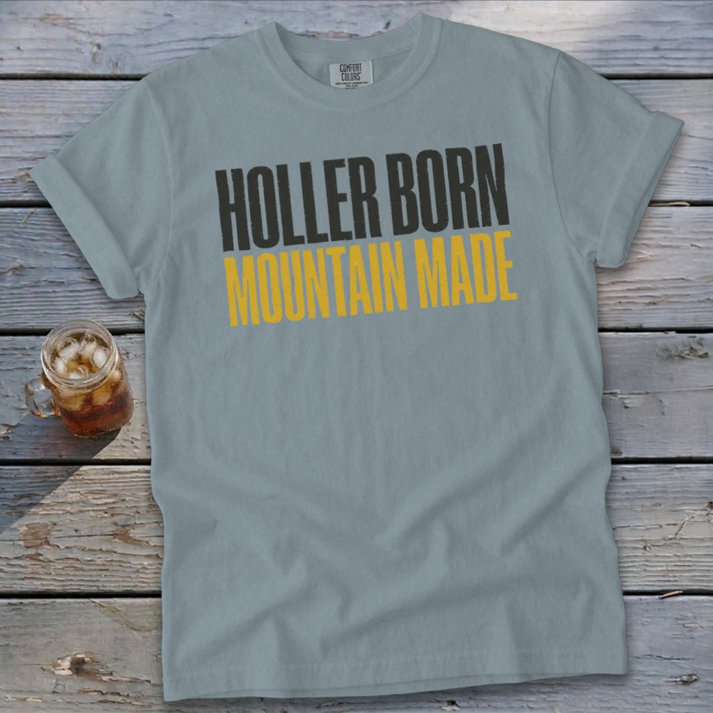 Light blue t-shirt with "HOLLER BORN MOUNTAIN MADE" text.