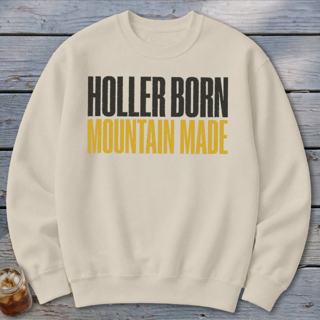 Cream sweatshirt with "HOLLER BORN MOUNTAIN MADE" text in black and yellow.