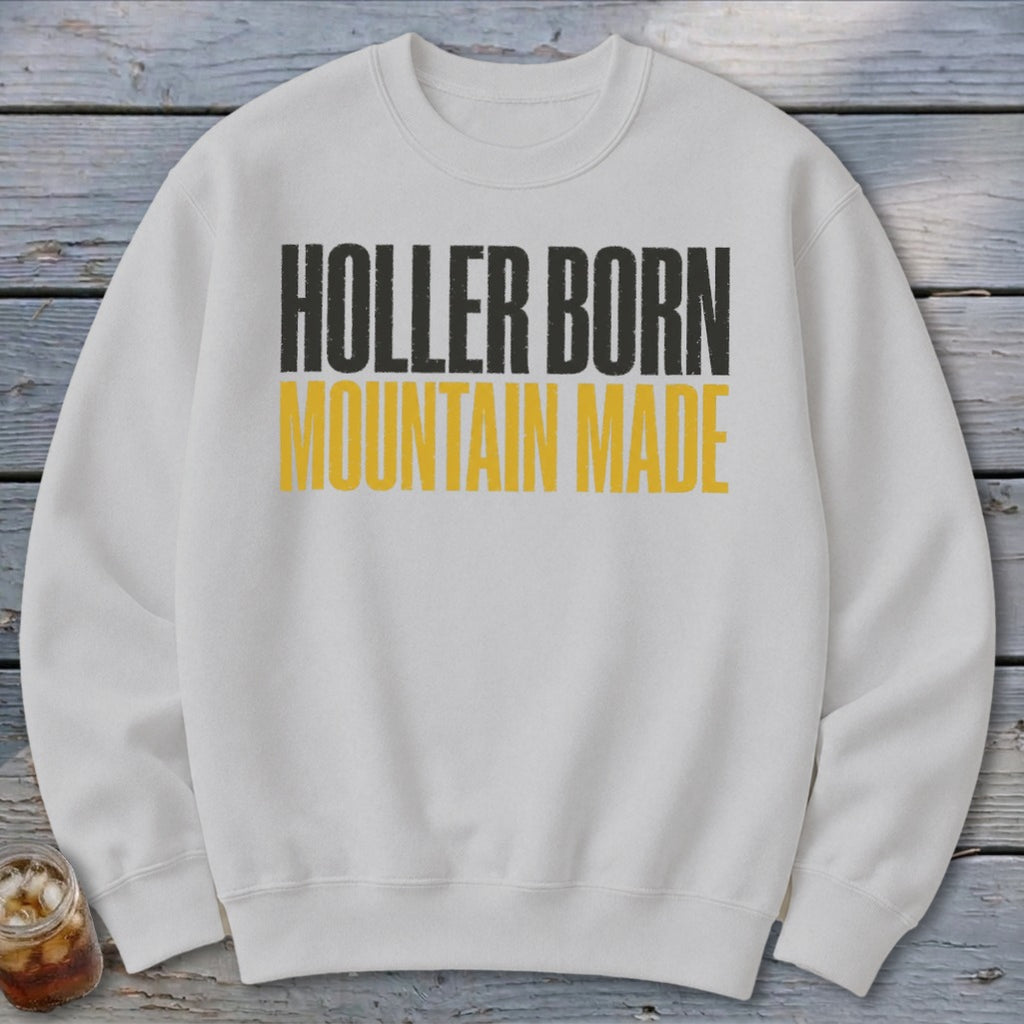 White sweatshirt with "HOLLER BORN MOUNTAIN MADE" printed in black and yellow text.