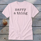 Pink t-shirt with black text reading "narry a thing" and a glass of iced tea.