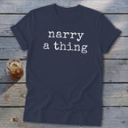Navy t-shirt with white text reading "narry a thing" on a wooden background.