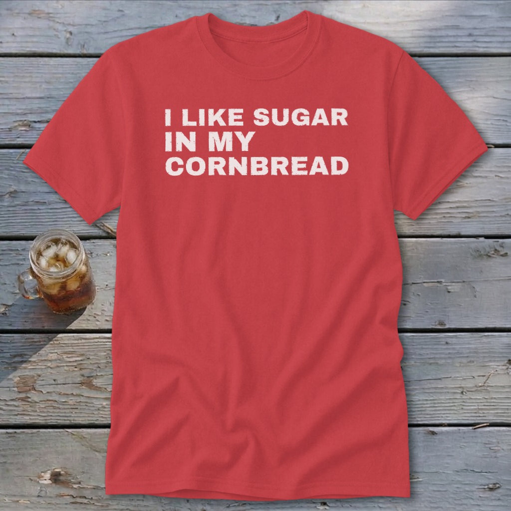 Red t-shirt with white text "I LIKE SUGAR IN MY CORNBREAD" and a glass of iced tea.