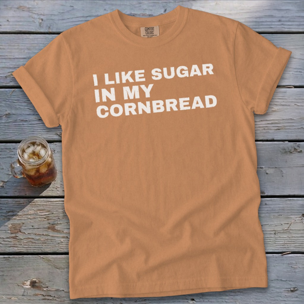 Orange t-shirt with white text "I LIKE SUGAR IN MY CORNBREAD".