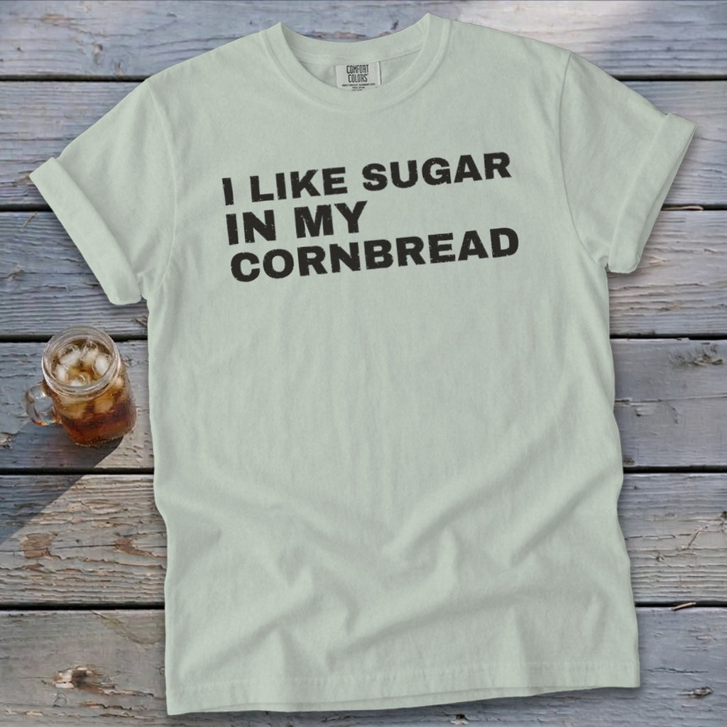 Light green t-shirt with black text "I LIKE SUGAR IN MY CORNBREAD".