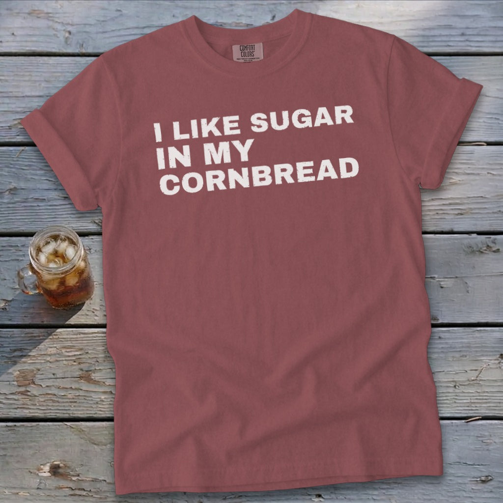 Red t-shirt with white text reading "I LIKE SUGAR IN MY CORNBREAD".
