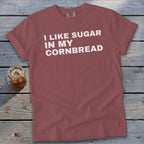 Red t-shirt with white text reading "I LIKE SUGAR IN MY CORNBREAD".