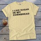 Yellow t-shirt with black text "I LIKE SUGAR IN MY CORNBREAD."